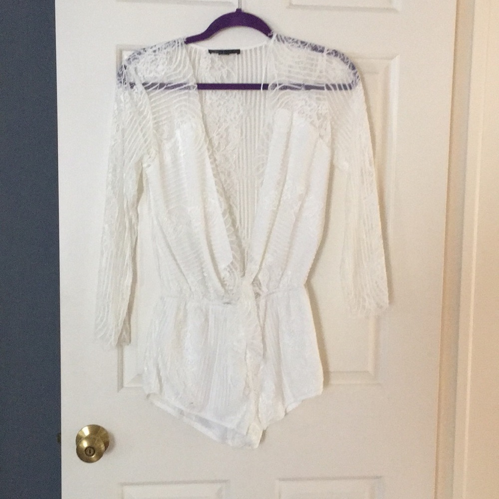 Cute white low cut romper.